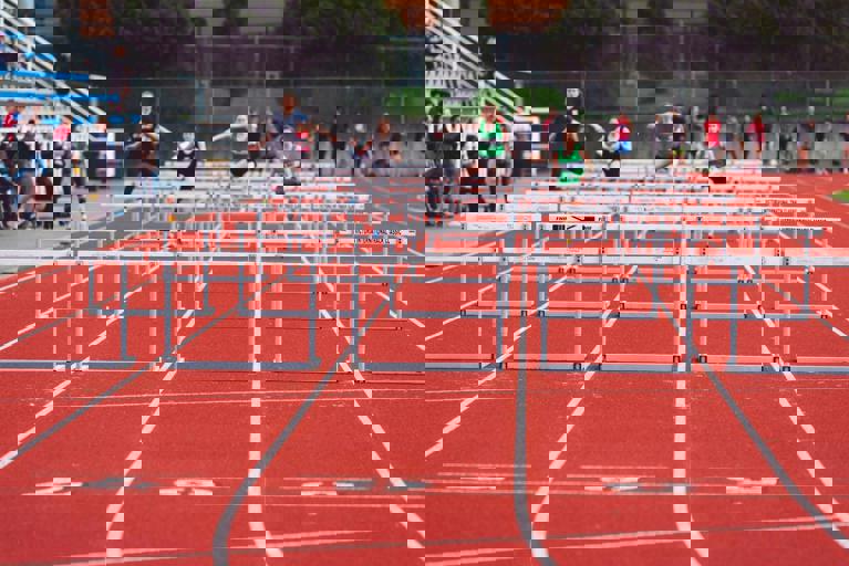 Canadian Sprinter Shatters National Record in Rain-Soaked Finals